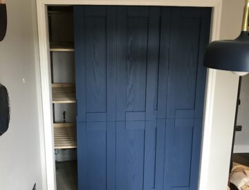 Bespoke solid ash sliding doors installed in Digby Lincolnshire concealing boiler cupboard