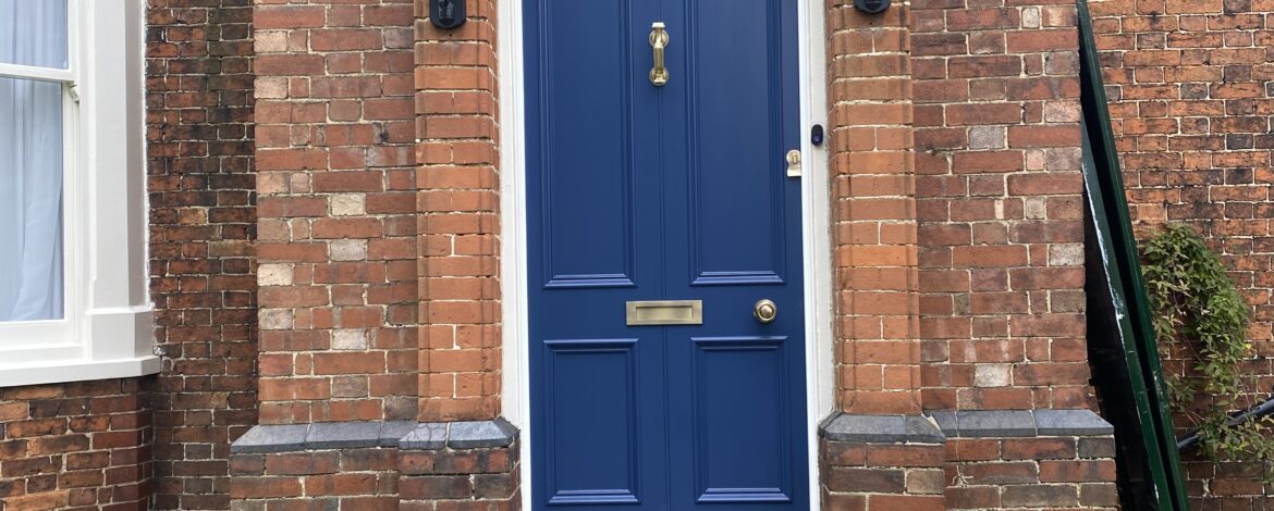 Victorian front door installed within brick arch at listed property in Nettleham