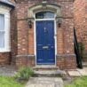 Victorian front door installed within brick arch at listed property in Nettleham