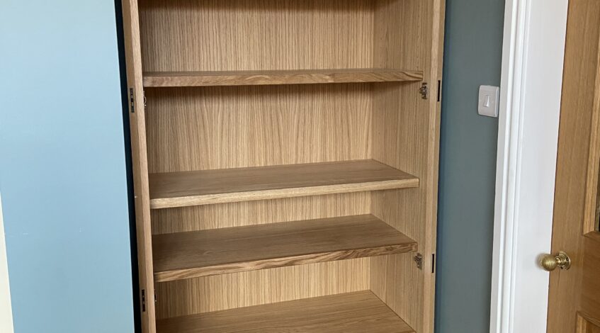 Oak veneered shelving inside bespoke alcove cupboard Woodhall Spa