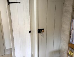 Painted ledged and braced internal door with handmade ironmongery
