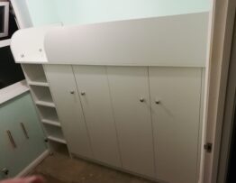 Bespoke mid sleeper bed with storage and wardrobe below in Grantham Lincolnshire