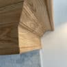 Detailed shaped oak bracket and moulded profile on extractor hood surround