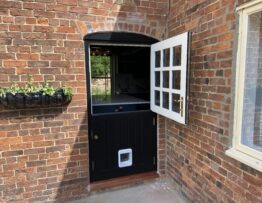 Bespoke Accoya stable door with glazed top section open at property in Lincolnshire