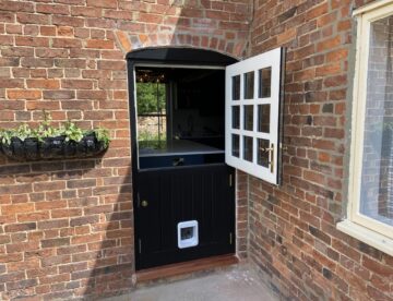 Bespoke Accoya stable door with glazed top section open at property in Lincolnshire