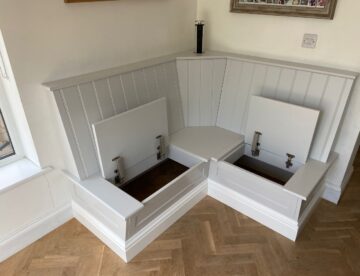 Corner bench seat with lift up storage sections open showing internal space