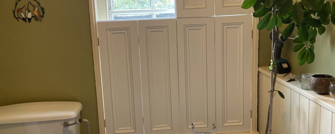 Tier on tier style bespoke shutters bathroom Lincoln upper panels open