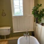 Tier on tier style bespoke shutters bathroom Lincoln upper panels open