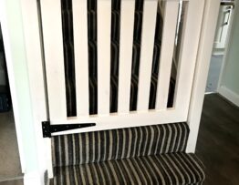 Bespoke stair gate manufactured in Tulip wood and spray finished in Brilliant White in Lincoln