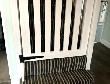 Bespoke stair gate manufactured in Tulip wood and spray finished in Brilliant White in Lincoln