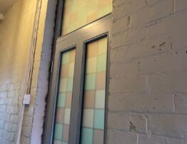External view of Accoya front door with coloured glazed panels in Lincoln.