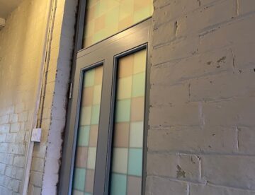 External view of Accoya front door with coloured glazed panels in Lincoln.