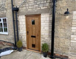 Bespoke cottage style oak front door in Digby Lincoln with vision panel