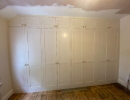 Bespoke fitted wardrobes built into angled ceiling space in Canwick Lincoln.