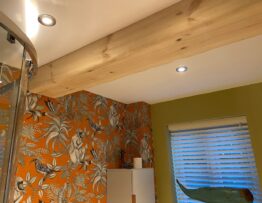 Close up detail of bespoke pine mock ceiling beam installation