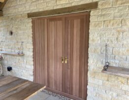 External view of bespoke boarded Sapele double doors with matching side panel in Lincolnshire.