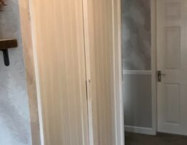 Tongue and groove panel detail on bespoke sliding hallway doors by Radial Joinery.