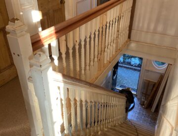 Victorian staircase with replacement wall panelling and handrail work in Lincoln property.