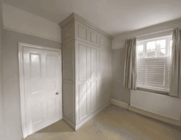 Bespoke floor-to-ceiling fitted wardrobe in Lincoln by Radial Joinery