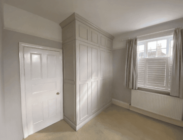 Bespoke floor-to-ceiling fitted wardrobe in Lincoln by Radial Joinery