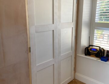 Matching pair of bespoke internal doors fitted to a walk-in wardrobe opening in Branston.