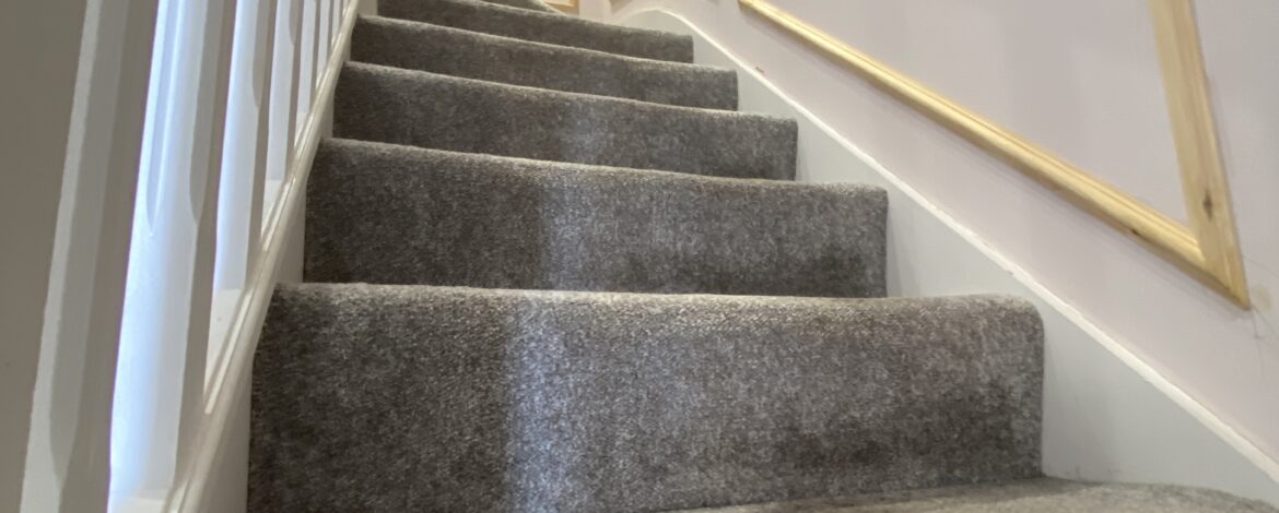 Bespoke timber panelling following the slope and proportions of the staircase.